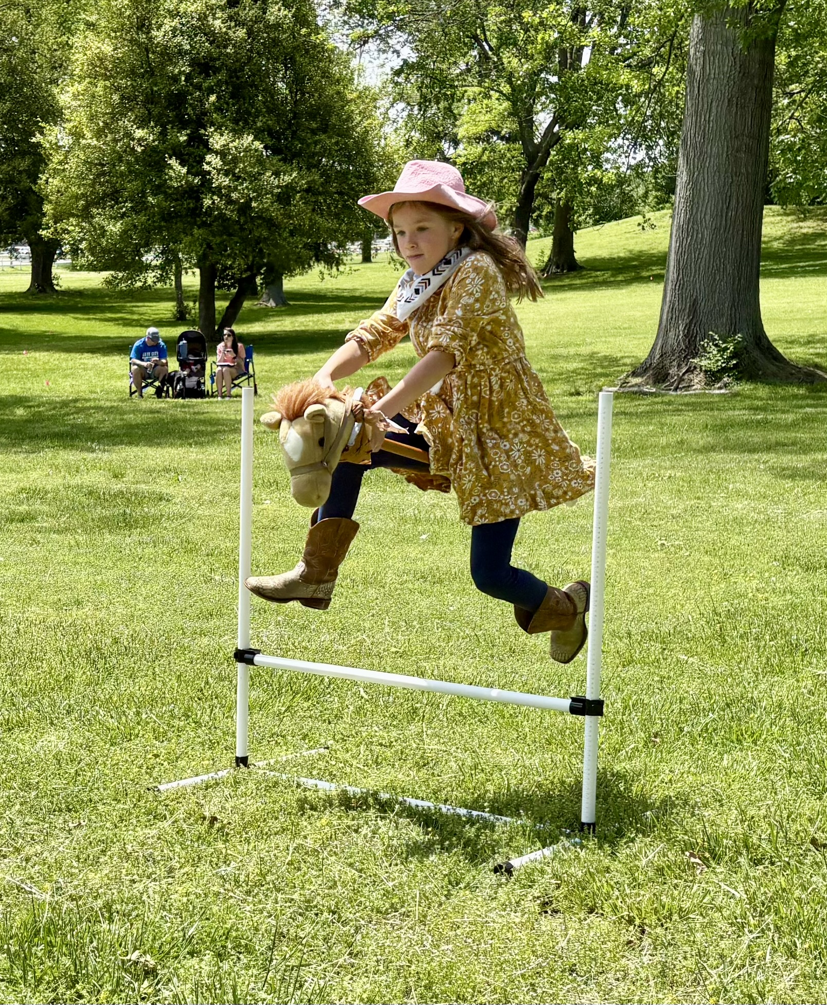 girl riding a hobby horse