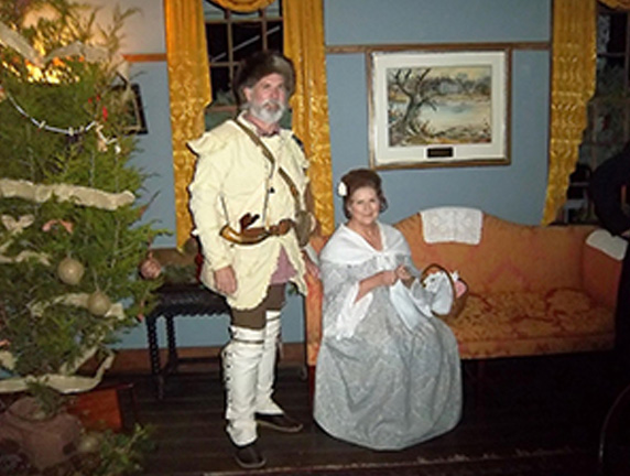 Staff in historical attire at a previous 1818 Christmas at the Inn event.